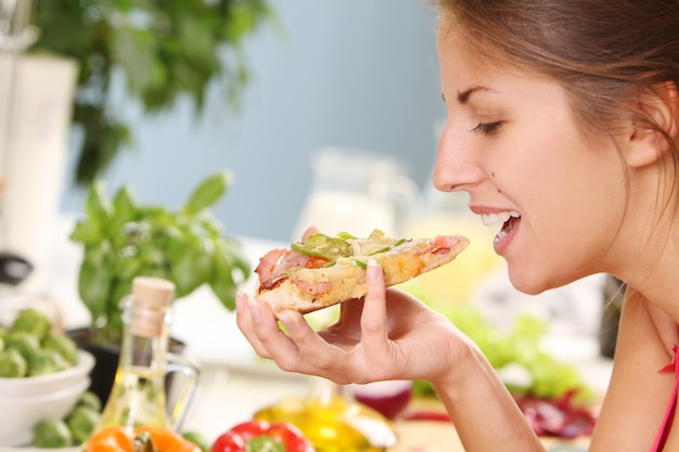 Beautiful woman with pizza