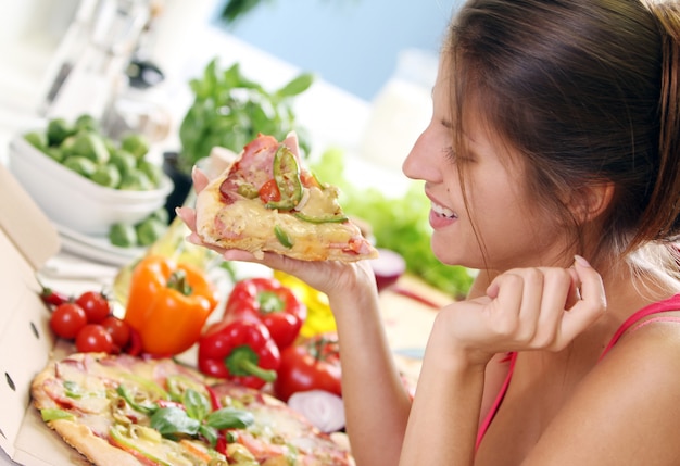 Free Photo beautiful woman with pizza