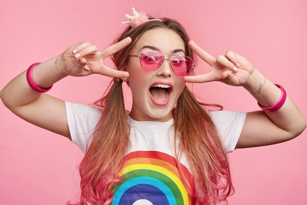 Beautiful woman with trendy pink sunglasses