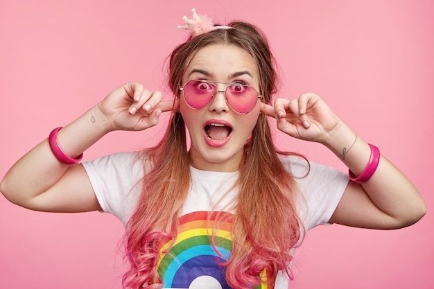 Beautiful woman with trendy pink sunglasses