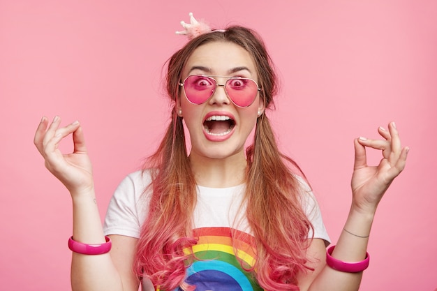 Beautiful woman with trendy pink sunglasses