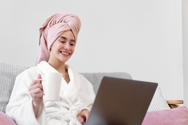 Beautiful woman working after taking a bath