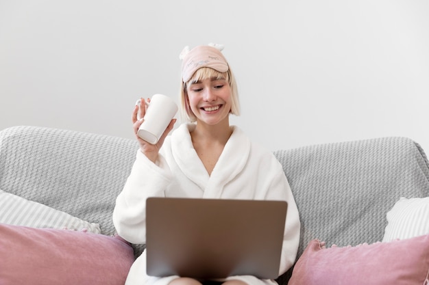 Beautiful woman working after waking up of her sleep