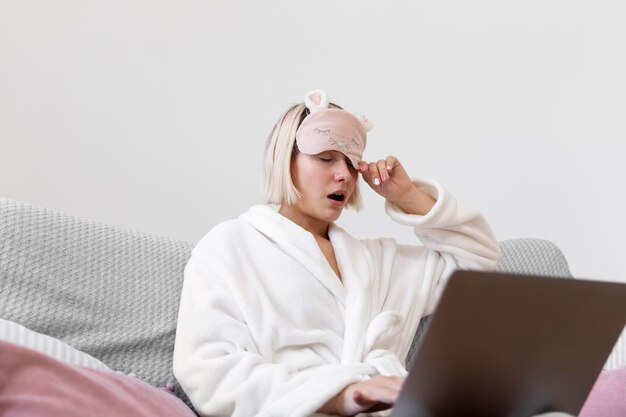 Beautiful woman working after waking up of her sleep