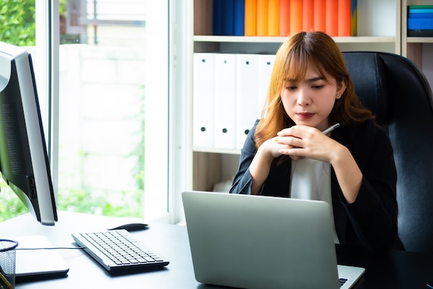 Beautiful woman working hard in the office