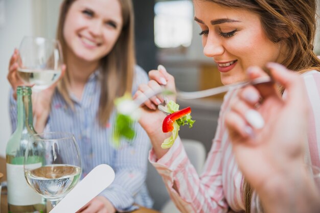 Beautiful women enjoying meal