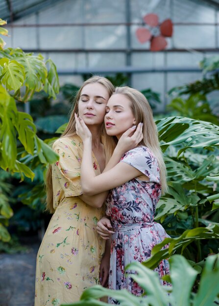 Beautiful women posing while hugging