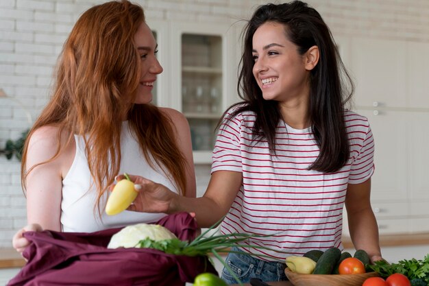 Beautiful women preparing together their dinner