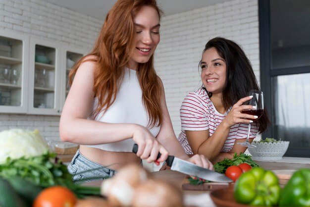 Beautiful women preparing together their dinner