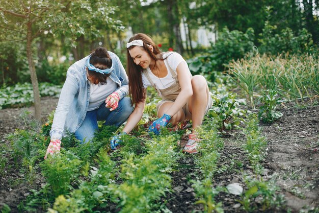 Beautiful women works in a garden 