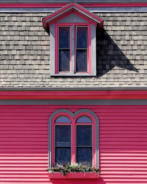 beautiful wooden pink and grey house