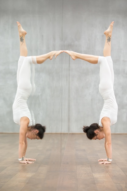 Free photo beautiful yoga: woman doing handstand posture