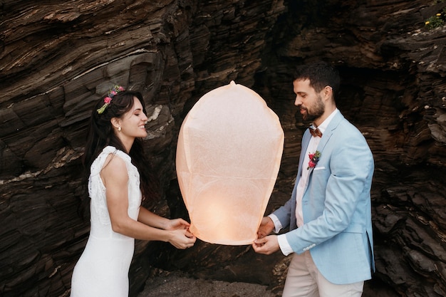 Beautiful young couple having their wedding on the beach