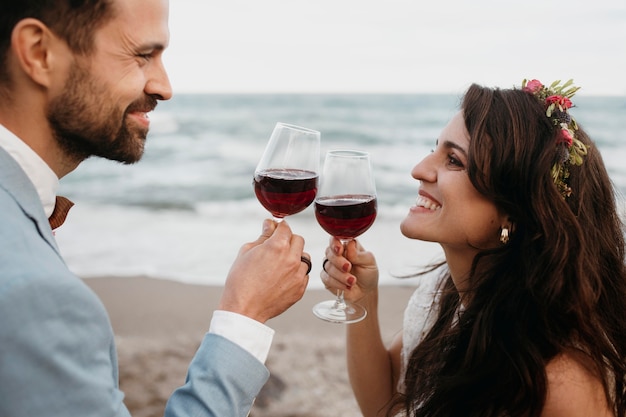 Beautiful young couple having their wedding on the beach