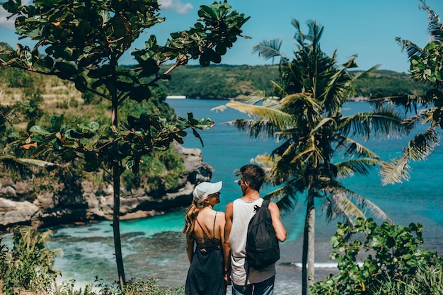 Free Photo beautiful young couple posing on the sea and beach love and tenderness