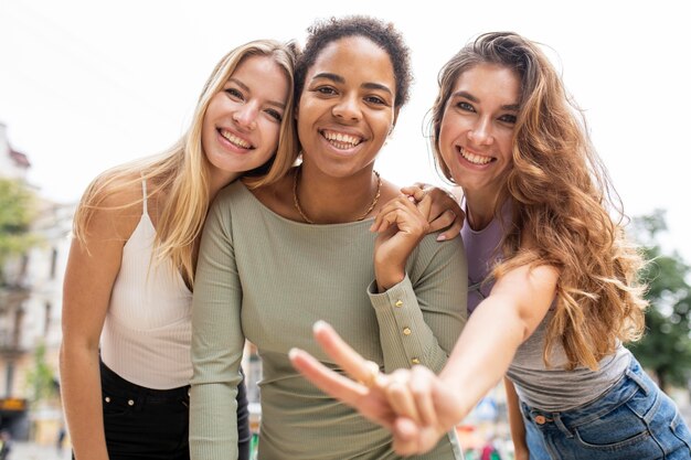 Beautiful young friends laughing low view