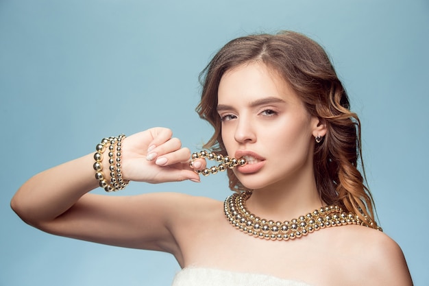 Free Photo beautiful young girl with pearl jewelry