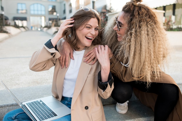 Beautiful young girls laughing together