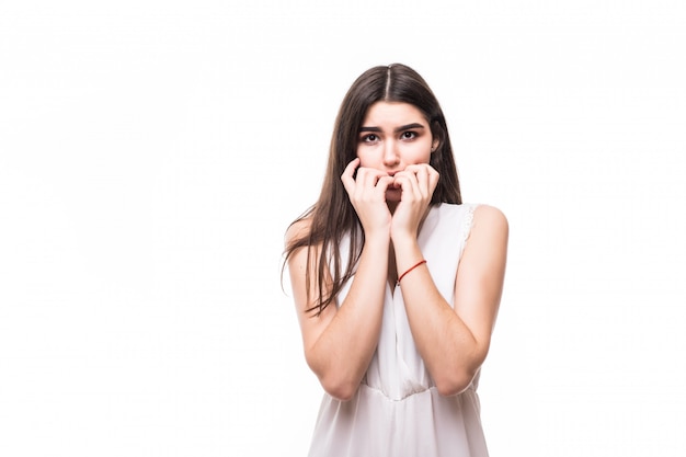 Free photo beautiful young model in modern white dress on white embarrassed scary sign