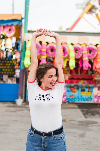 Beautiful young woman in the amusement park