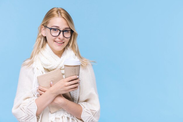 Beautiful young woman holding a book