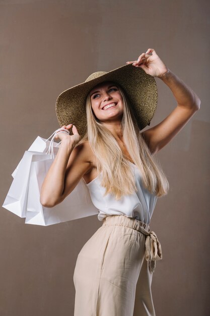 Beautiful young woman holding shopping bags