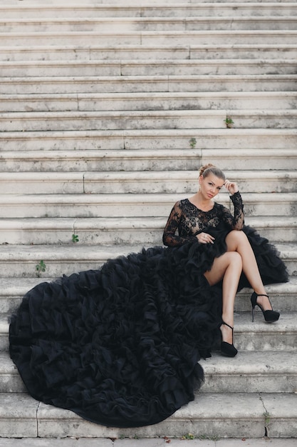 Free Photo beautiful young woman in a luxurious black dress in montenegro