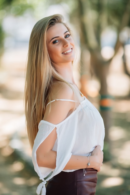 Beautiful young woman portrait outdoor in the park