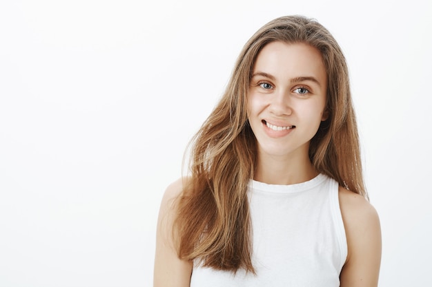 Beautiful young woman smiling broadly