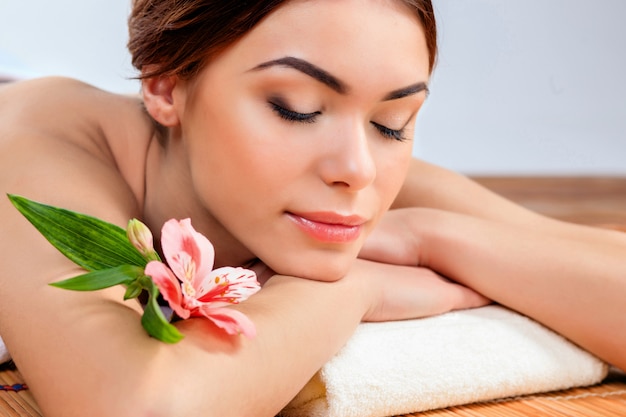 Beautiful young woman at a spa salon