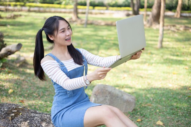 Beautiful young woman using laptop