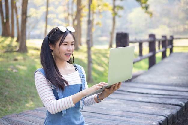 Beautiful young woman using laptop