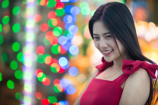 Beautiful young woman walking in the street 