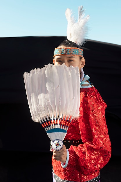 Free Photo beautiful young woman wearing native american costume