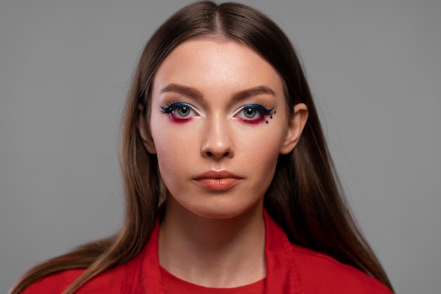 Beautiful young woman wearing professional makeup