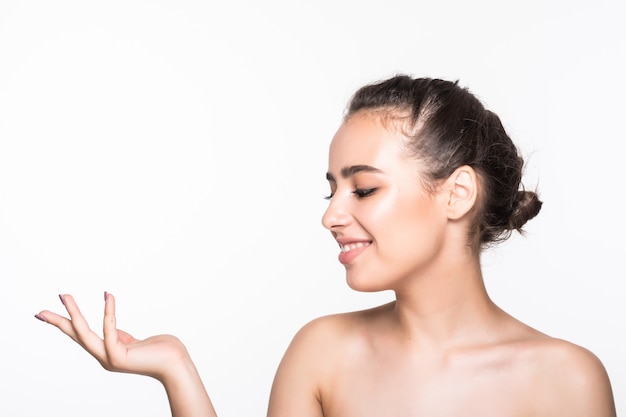 Beautiful young woman with clean fresh skin posing