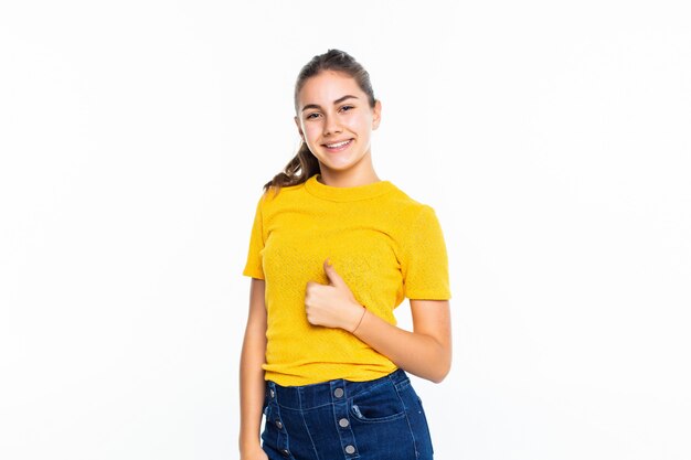 Beautiful young woman with thumbs up isolated on white wall