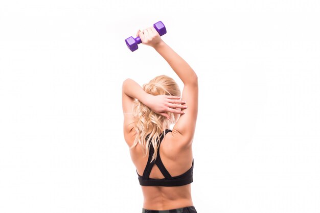 Beauty in black top do exercises for her back with elegant dumbbells