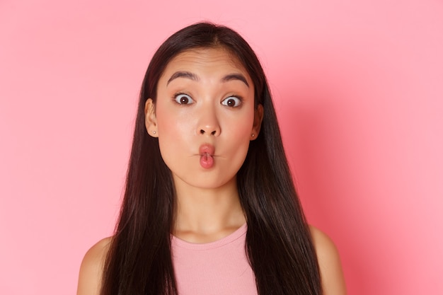 Free Photo beauty fashion and lifestyle concept portrait of funny and playful silly asian girl looking surprise...