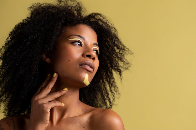 Beauty portrait of afro woman with ethnic makeup