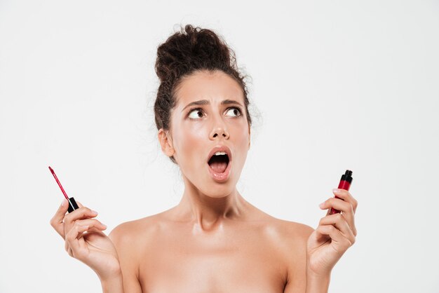 Beauty portrait of an astonished brunette woman