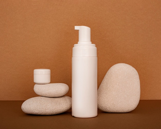 Free photo beauty products in recipients assortment on beige stones