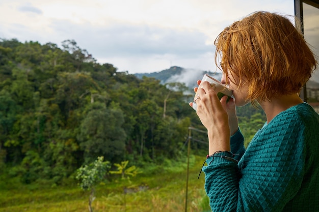 Free photo beauty red head cold forest coffee