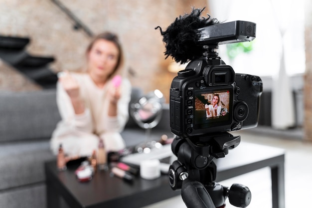 Beauty vlogger doing a video at home