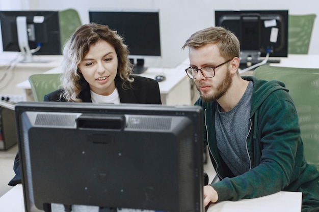 Free Photo beauty with friend. man and woman communicate. students study computer science.