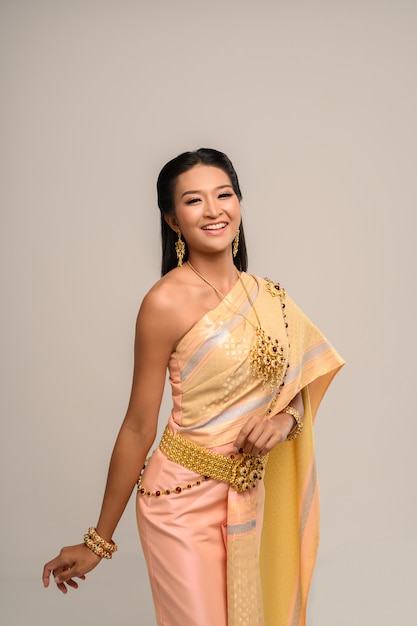 Free photo beautyful thai woman wearing thai dress and smile