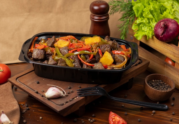 Beef pan baebacue, bbq with grilled potatoes and bell peppers   