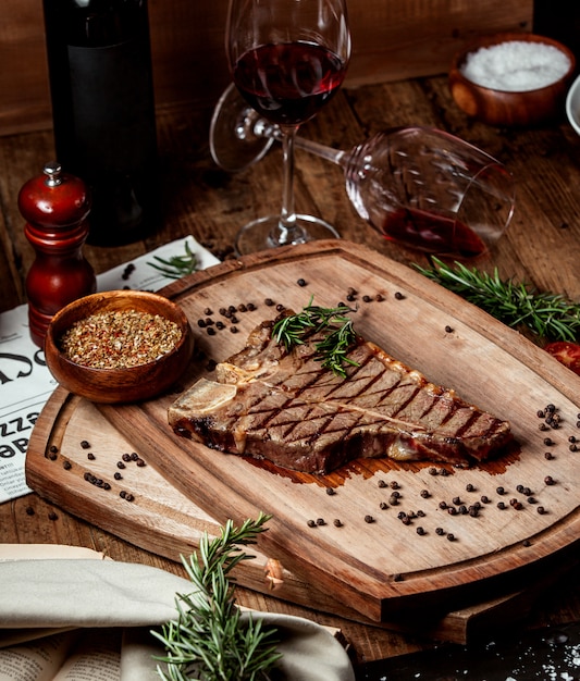 beef stek piece garnished with dried herbs and black pepper