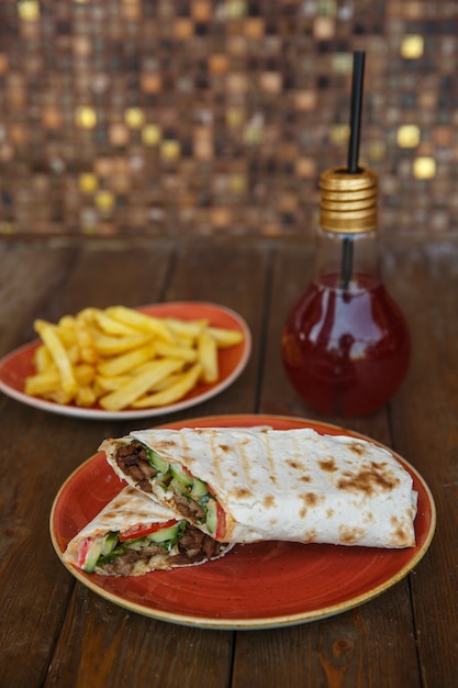 Beef wraps in flatbread with cucumber, tomato and mayonnaise