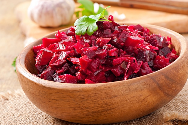 Beet salad Vinaigrette in a wooden bowl